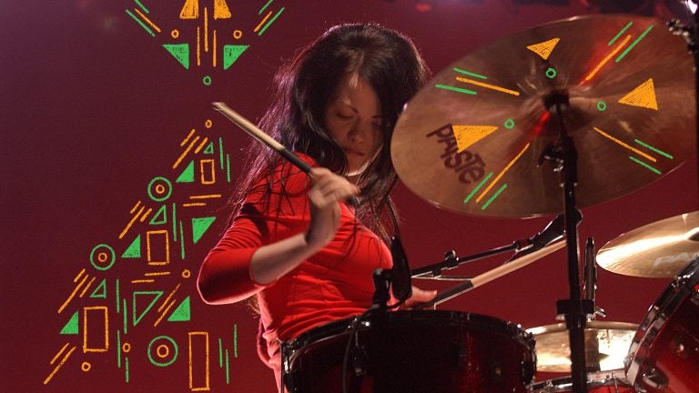 Meg White performs in Australia in 2003. (Photo Illustration: Bob King/Redferns and Angela Hsieh/NPR)