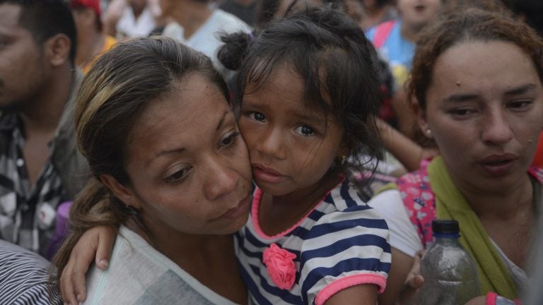 Thousands of migrants attempted to cross the border from Guatemala into Mexico this week. Many of the migrants have reportedly returned to their home countries of Honduras and Guatemala. (Oliver de Ros/AP)