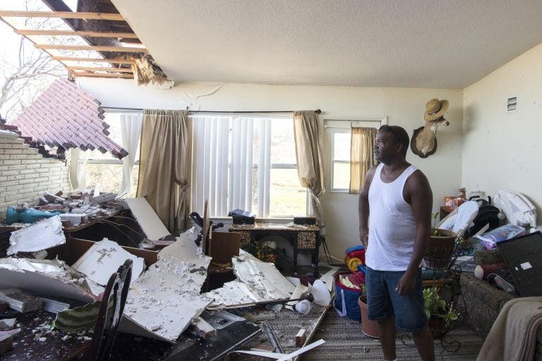 Robert Hill surveys the damage within his living room on Wednesday at Tyndall Air Force Base after Hurricane Michael hit the base last week. Support personnel from Tyndall and other bases were on location to support Airmen returning to their homes to assess damage and collect personal belongings. Robert Hill surveys the damage within his living room on Wednesday at Tyndall Air Force Base after Hurricane Michael hit the base last week. Support personnel from Tyndall and other bases were on location to support Airmen returning to their homes to assess damage and collect personal belongings. (Kelly Walker/U.S. Air Force)
