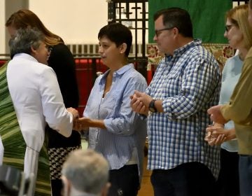 Nicole and Chuck Gesing attend Sunday Mass at St. Peter's Episcopal Church in Glenside, Pa. (Bastiaan Slabbers for Keystone Crossroads)