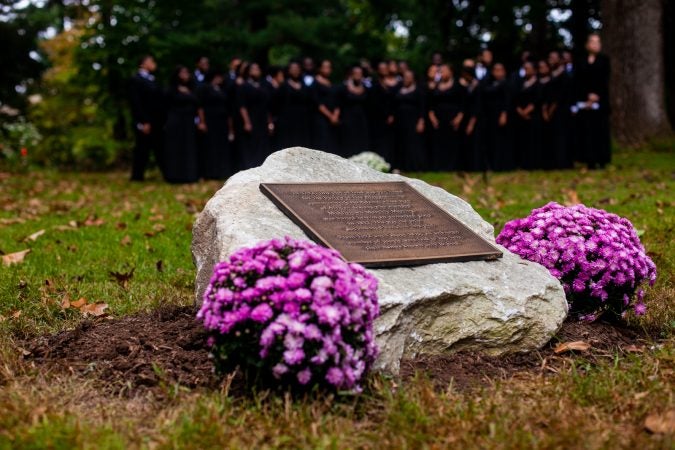 A memorial stone to commemorate the forgotten slaves buried on the grounds of Middletown Friends Meeting at Langhorne, Pa. on Saturday, Oct. 6, 2018. (Brad Larrison for WHYY)