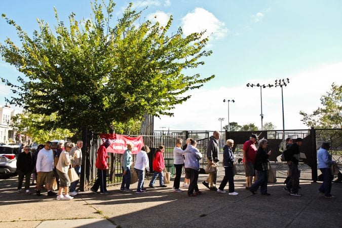 Seniors line up outside Cohocksink Recreation Center in Port Richmond Friday to attend the Senior Expo. (Kimberly Paynter/WHYY)