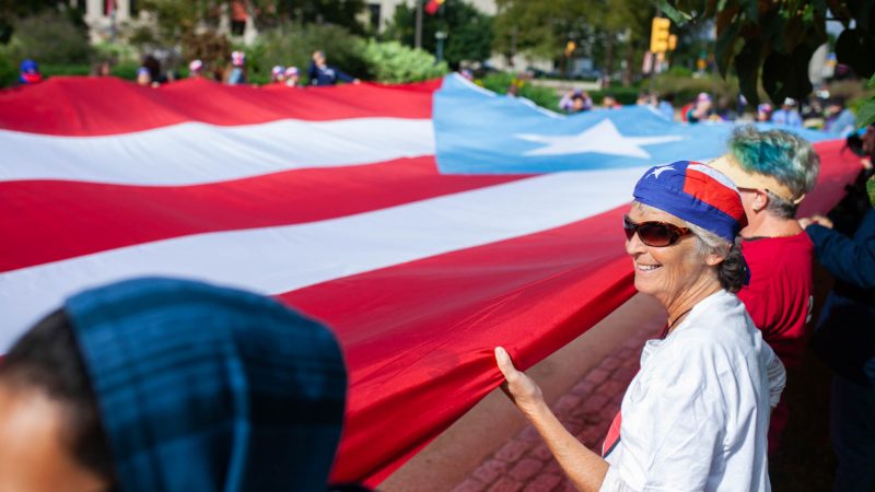 Lisa Young from Viequez, Puerto Rico, was one of the first responders during Hurricane Maria. She joined a group of activists who marched  on the Benjamin Franklin Parkway Saturday to commemorate the people who died as a result Hurricane Maria in Puerto Rico. (Miguel Martinez for WHYY)