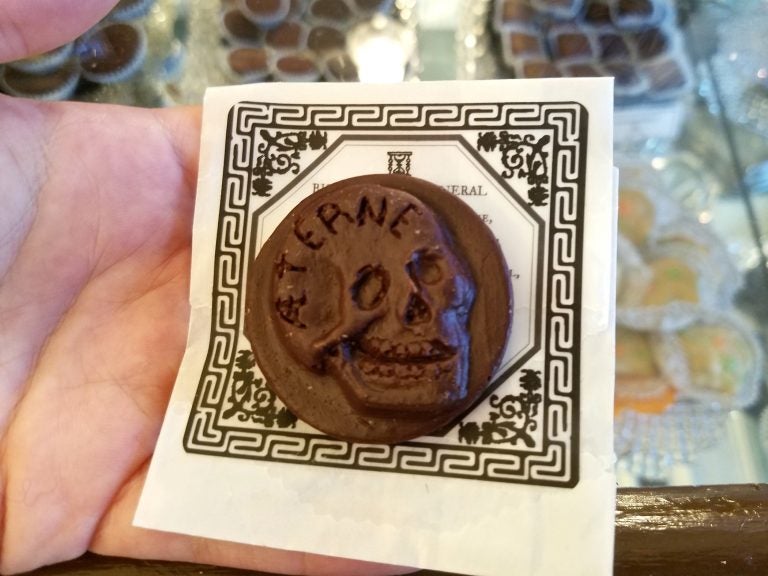 A traditional Victorian funeral biscuit, recreated as a chocolate medallion, is for sale at Shane Confectionery in Old City. (Peter Crimmins/WHYY)