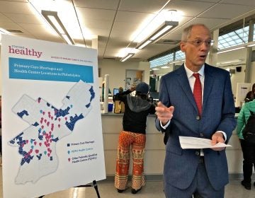 Philadelphia Health Commissioner Tom Farley uses a map to illustrate primary care shortages in neighborhoods in the city's Northeast and Southwest. (Nina Feldman/WHYY)