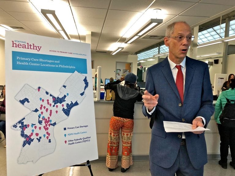 Philadelphia Health Commissioner Tom Farley uses a map to illustrate primary care shortages in neighborhoods in the city's Northeast and Southwest. (Nina Feldman/WHYY)