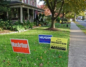 Yard signs on Second Street in Moorestown, New Jersey, support the Republican slate, topped by Bob Hugin for Senate and Tom MacArthur for Congress.