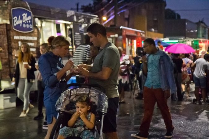 ain doesn’t hold off the crowd at the Point Breeze Night Market. (Kimberly Paynter/WHYY)