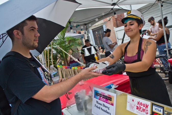 Lydia Heier serves fried ice cream at the Point Breeze Night Market. (Kimberly Paynter/WHYY)