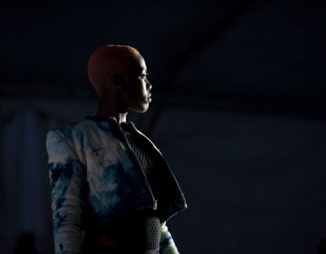 A model poses at the end of the runway during Philadelphia Fashion Week, held at Dilworth Park.