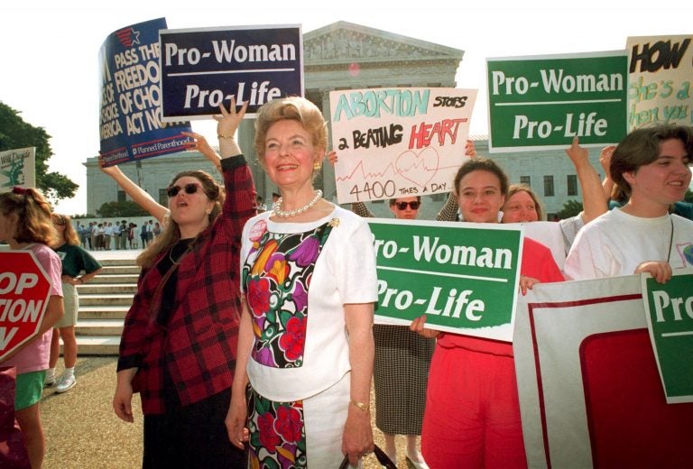 Anti-abortion demonstrators, including Phyllis Schlafly, foreground, rally at the U.S. Supreme Court in Washington, D.C., on June 29, 1992. The high court upheld most provisions of a restrictive Pennsylvania abortion law.
