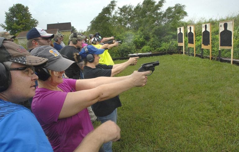 Teacher Gun Class Educators fire off rounds during a concealed carry class for teachers Sunday, June 10, 2018, at Adventure Tactical Training in Farmer City, Illinois. The class was designed to help teachers feel less vulnerable in the wake of a number of recent school shootings across the country. (David Proeber, The Pantagraph via AP)