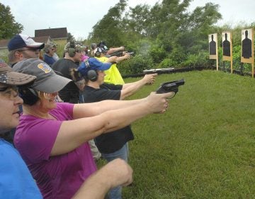 Educators fire off rounds during a concealed carry class for teachers Sunday, June 10, 2018, at  Adventure Tactical Training in Farmer City, Illinois. The class was designed to help teachers feel less vulnerable in the wake of a number of recent school shootings across the country.  (David Proeber, The Pantagraph via AP)