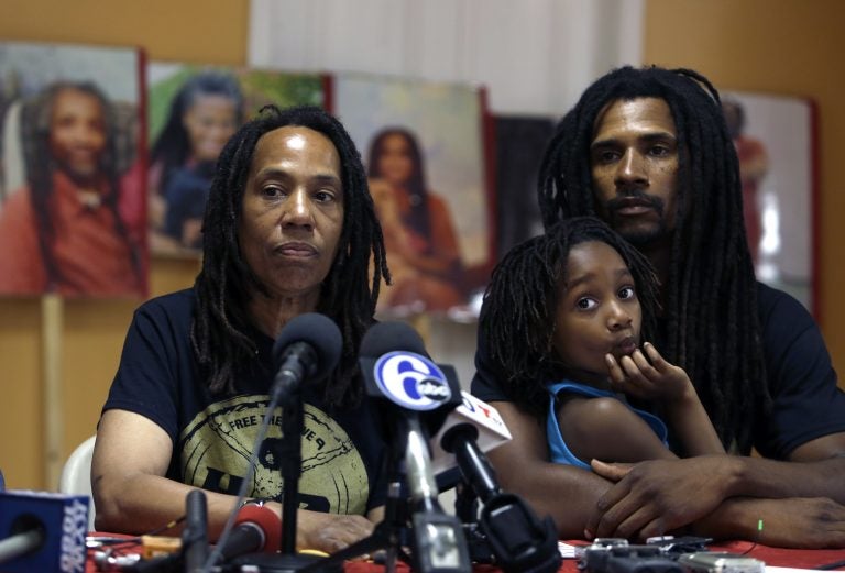 Debbie Africa, (left), participates in a news conference alongside her son Michael Africa, Jr. and granddaughter Alia, 6, Tuesday June 19, 2018, in Philadelphia. Africa, a member of the radical group MOVE, was released from prison on Saturday, nearly 40 years after the group engaged in a shootout that killed a Philadelphia police officer in 1978. Michael Africa, Sr., has now also been released.  (Jacqueline Larma/AP Photo)