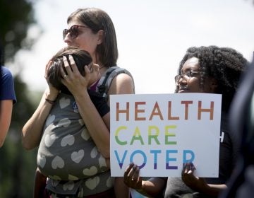 Families affected by pre-existing conditions attend a news conference on Capitol Hill in Washington, Tuesday, June 26, 2018. (Andrew Harnik/AP Photo)