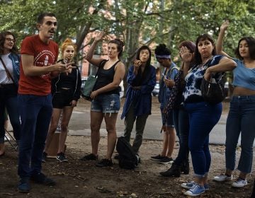An organizer for the Democratic Socialists of America, second from left in red shirt, coaches sex workers and allies before they canvass for Julia Salazar, who is running for a seat in the New York State Senate. Salazar supports decriminalizing sex work and repealing laws that target people in the sex industry. (AP Photo/Andres Kudacki)