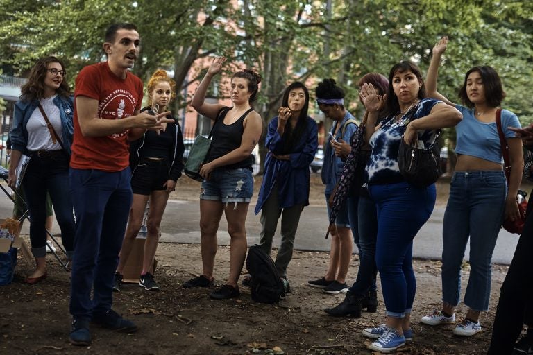 An organizer for the Democratic Socialists of America, second from left in red shirt, coaches sex workers and allies before they canvass for Julia Salazar, who is running for a seat in the New York State Senate. Salazar supports decriminalizing sex work and repealing laws that target people in the sex industry. (AP Photo/Andres Kudacki)