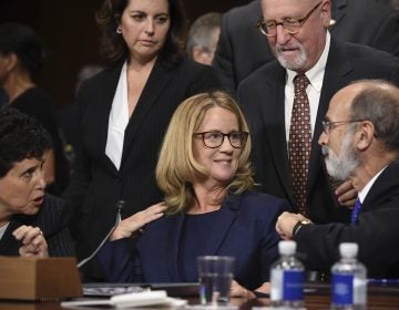 Christine Blasey Ford, the woman accusing Supreme Court nominee Brett Kavanaugh of sexually assaulting her at a party 36 years ago, chats with her attorneys as she testifies before the US Senate Judiciary Committee on Capitol Hill in Washington, DC, September 27, 2018. (Saul Loeb/Pool Photo via AP)