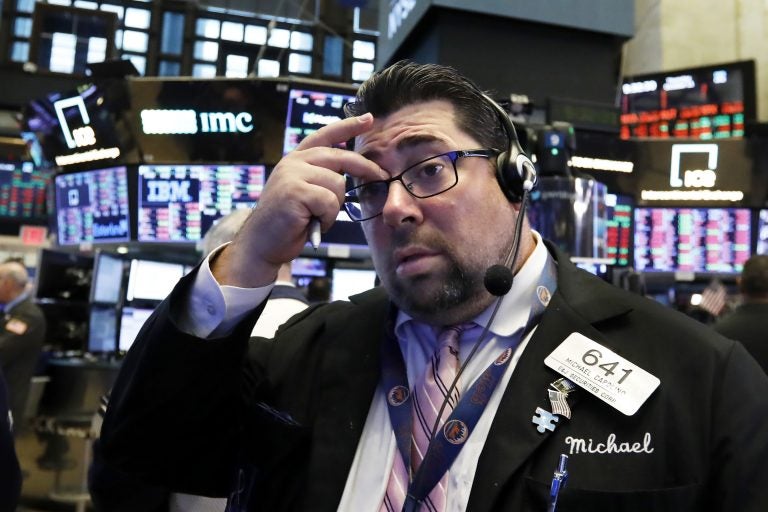 Trader Michael Capolino works on the floor of the New York Stock Exchange, Thursday, Oct. 11, 2018. The market's recent decline was set off by a sharp drop in bond prices and a corresponding increase in yields last week and early this week. (Richard Drew/AP Photo)