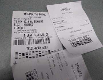 This Oct, 12, 2018 photo shows losing betting slips in Atlantic City, N.J. that had predicted the New York Yankees to either reach the World Series or win it. New Jersey gambling regulators were set to announce figures on Oct. 12 showing a 