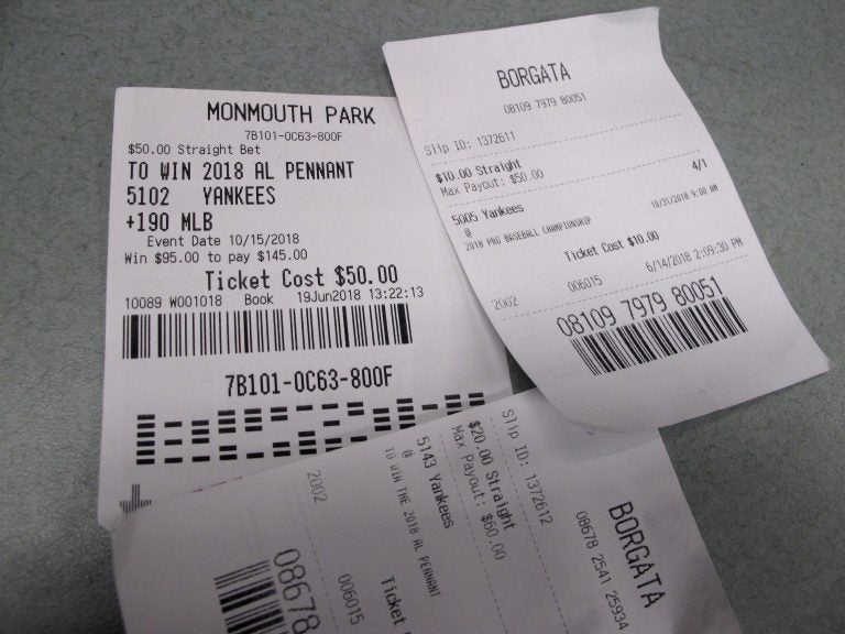 This Oct, 12, 2018 photo shows losing betting slips in Atlantic City, N.J. that had predicted the New York Yankees to either reach the World Series or win it. New Jersey gambling regulators were set to announce figures on Oct. 12 showing a 