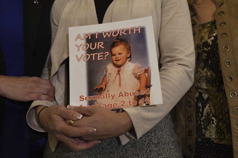 Carolyn Fortney, a survivor of sexual abuse at the hands of her family's Roman Catholic parish priest as a child, awaits legislation in the Pennsylvania Capitol to respond to a landmark state grand jury report on child sexual abuse in the Catholic Church, Wednesday, Oct. 17, 2018 in Harrisburg, Pa. (Marc Levy/AP Photo)