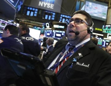 Trader Michael Capolino works on the floor of the New York Stock Exchange, Thursday, Oct. 25, 2018. Strong results from major companies including Microsoft, Visa and Comcast are sending U.S. stocks higher Thursday morning as the market found its footing after three weeks of steep declines. (Richard Drew/AP Photo)