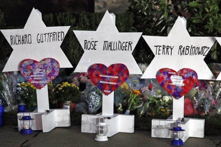 This photo shows some of Stars of David with names of those killed at the Tree of Life Synagogue in Pittsburgh in Saturday's shooting, at a memorial outside the synagogue. (AP Photo/Gene J. Puskar)