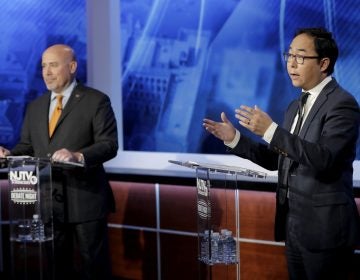 Andy Kim, right, the Democratic candidate in the U.S. Congressional District 3 race, speaks during a debate with Republican candidate Tom MacArthur, Wednesday, Oct. 31, 2018, in Newark, N.J. (AP Photo/Julio Cortez)