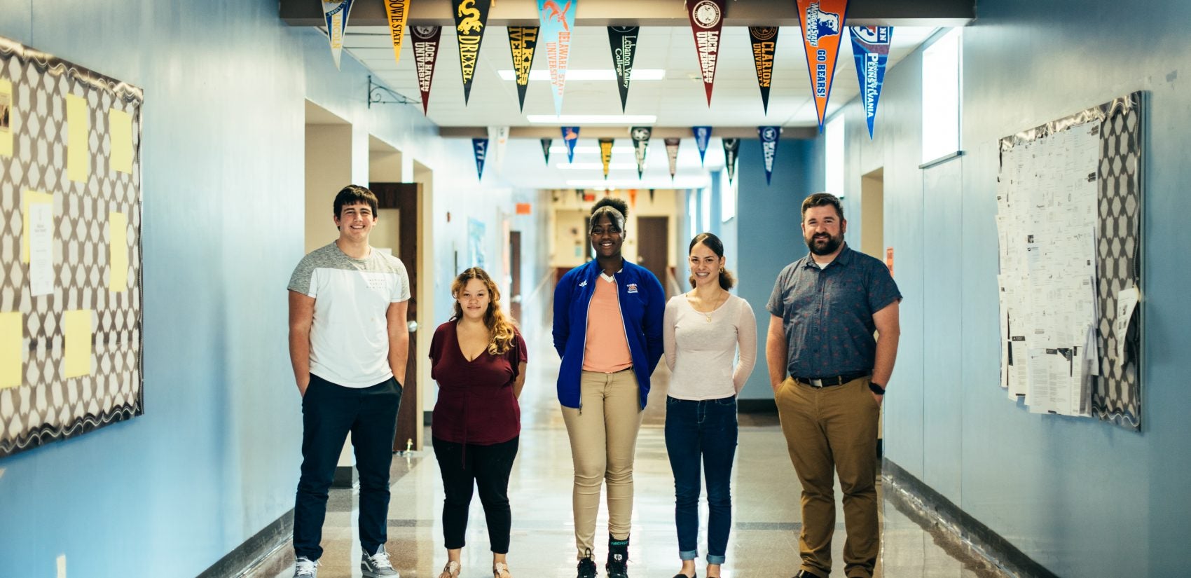 (From L to R) Students Trey Bernstein, Kelysha Huertas, Imani Marshall, and Carmen Gonzalez with teacher Alexander Gibson at William Penn Senior High School (Dani Fresh for WHYY)