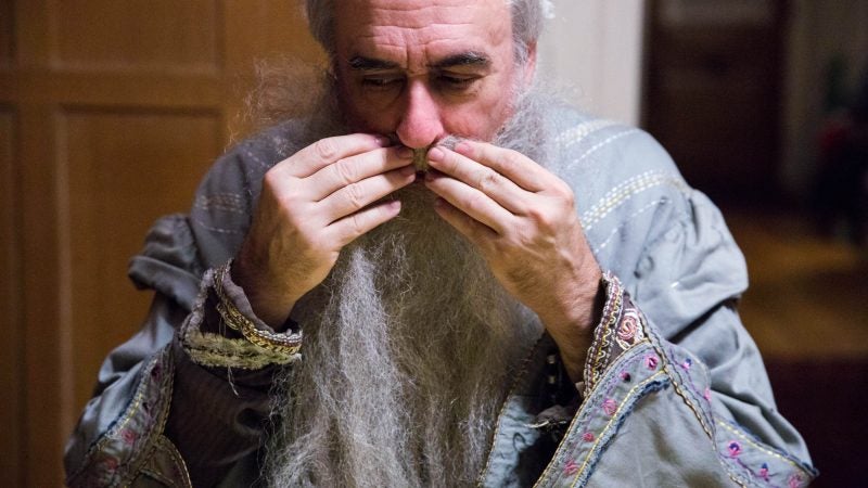 Walt Maguire attaches Dumbledore’s beard to his face using a temporary glue. Maguire feels great sadness about stepping down from his role as Hogwarts headmaster, saying that “when I heard it was being discontinued, my first thought was a slight resentment that I didn’t get to decide to stop.” (Rachel Wisniewski for WHYY)