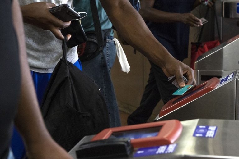 Commuters swipe their SEPTA key cards at the 69th Street Transportation Center in Upper Darby. (HEATHER KHALIFA / INQUIRER STAFF PHOTOGRAPHER)