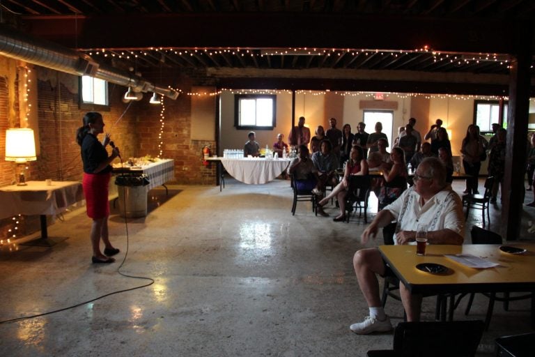 Elizabeth Fiedler, a candidate for state representative in Philadelphia, speaking at a fundraiser for DSA candidates in Pittsburgh. (Reid R. Frazier/StateImpact Pennsylvania)