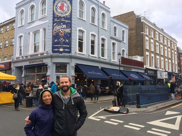 Melanie Manuel, left, and Chris Thomas on Portobello Road, just a block from their Notting Hill flat in London. Like thousands of other Pennsylvanians living abroad, Manuel and Thomas were initially blocked from applying for their absentee ballots because the Pa. Department of State website can’t be accessed from a foreign country (Jim Saksa/WHYY)
