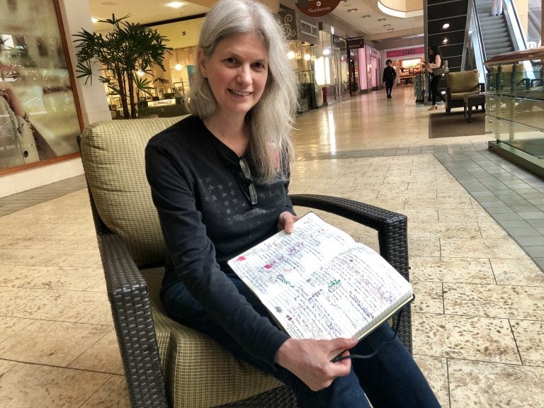 Macy’s worker Susan Hedman keeps a notebook of all her schedule changes so she can hold Macy’s accountable to Seattle’s secure scheduling law. (Juliana Reyes)