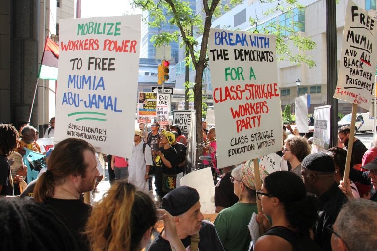 In August, demonstrators call for the release of Mumia Abu-Jamal who was convicted of killing a Philadelphia police officer in 1982. (Emma Lee/WHYY)