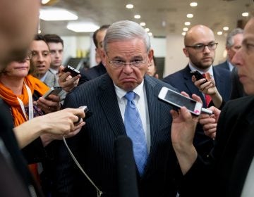 Sen. Bob Menendez, D-N.J., speaks with reporters on Capitol Hill in Washington, Tuesday, April 14, 2015. Menendez took a business-as-usual approach Monday when he returned to Congress for the first time since his April 1 indictment on federal corruption charges.