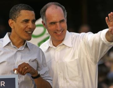 Democratic presidential hopeful, Sen. Barack Obama, D-Ill., left, looks at the crowd of supporters with Sen. Bob Casey at a rally outside the Lancaster, Pa., train station Saturday, April 19, 2008.