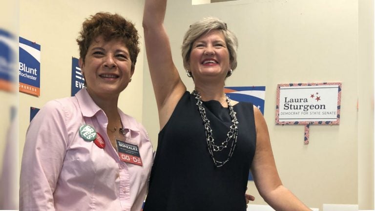 Guillermina Gonzalez (left) and Laura Sturgeon are running for the Delaware House and Senate, respectively. Both candidates participated in a September gun control rally in Hockessin. (Cris Barrish/WHYY)