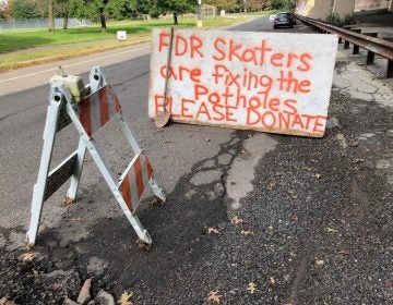 Skaters from FDR Skatepark set up a sign and 