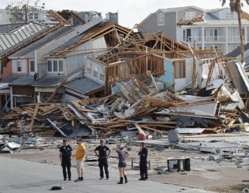 Rescue personnel search for people who may need help in Mexico Beach, Fla., on Thursday, one day after Hurricane Michael made landfall near the area. (Gerald Herbert/AP)
