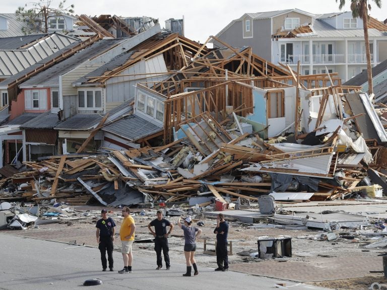 Rescue personnel search for people who may need help in Mexico Beach, Fla., on Thursday, one day after Hurricane Michael made landfall near the area. (Gerald Herbert/AP)