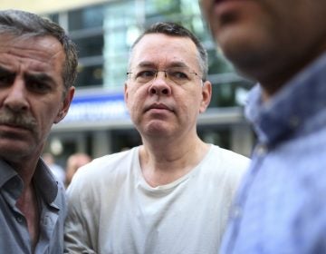 Andrew Brunson, seen here in July, arrives at his house flanked by Turkish officials in Izmir, Turkey. The newly freed U.S. pastor arrived Saturday on American soil, and he is meeting President Trump at the White House. Andrew Brunson, seen here in July, arrives at his house flanked by Turkish officials in Izmir, Turkey. The newly freed U.S. pastor arrived Saturday on American soil, and he is meeting President Trump at the White House. (Emre Tazegul/AP)