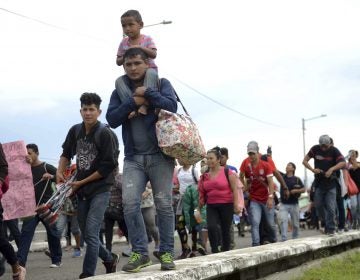 Thousands of Honduran migrants and families walk towards the southern Mexico border from Guatemala. Many say they are headed to the U.S. The White House said on Tuesday that a record number of migrant families have arrived at the Southwest border over the last year. (Oliver de Roos/AP)