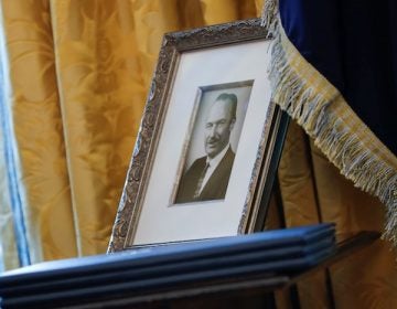 A photograph of Fred Trump on display in the Oval Office.