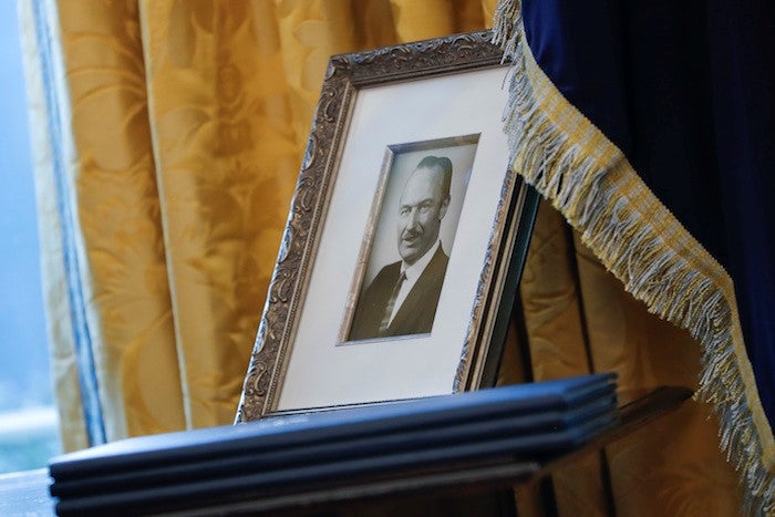 A photograph of Fred Trump on display in the Oval Office.