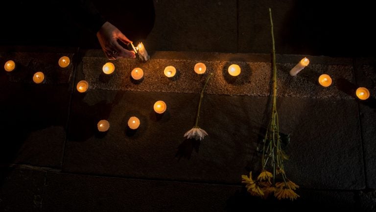 Chilean demonstrators light candles during an August vigil in Santiago that protested the sex abuse scandal roiling the Catholic Church. (Martin Bernetti/AFP/Getty Images)