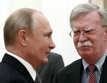 National Security Adviser John Bolton speaks with Russian President Vladimir Putin at the Kremlin on Tuesday. After their meeting, Bolton told reporters the U.S. still intends to withdraw from the Cold War-era Intermediate-Range Nuclear Forces Treaty. (Maxim Shipenkov/AFP/Getty Images)
