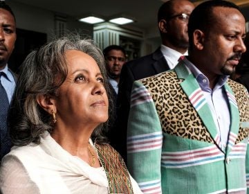 Sahle-Work Zewde walks with Prime Minister Abiy Ahmed after being appointed Ethiopia's first female president at the country's parliament in Addis Ababa on Thursday.
(Eduardo Soteras/AFP/Getty Images)