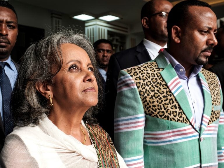 Sahle-Work Zewde walks with Prime Minister Abiy Ahmed after being appointed Ethiopia's first female president at the country's parliament in Addis Ababa on Thursday.
(Eduardo Soteras/AFP/Getty Images)